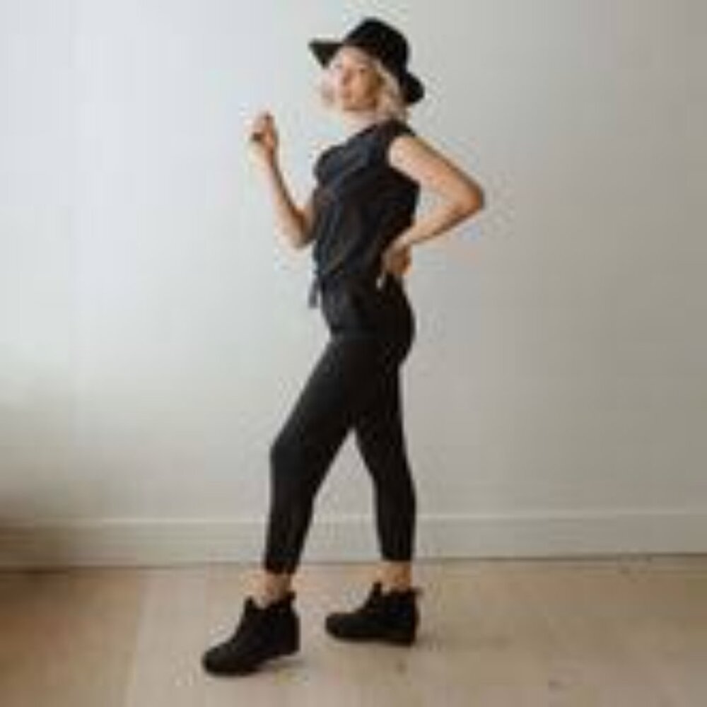 Girl’s Albion black jump suit with cuff sleeve.